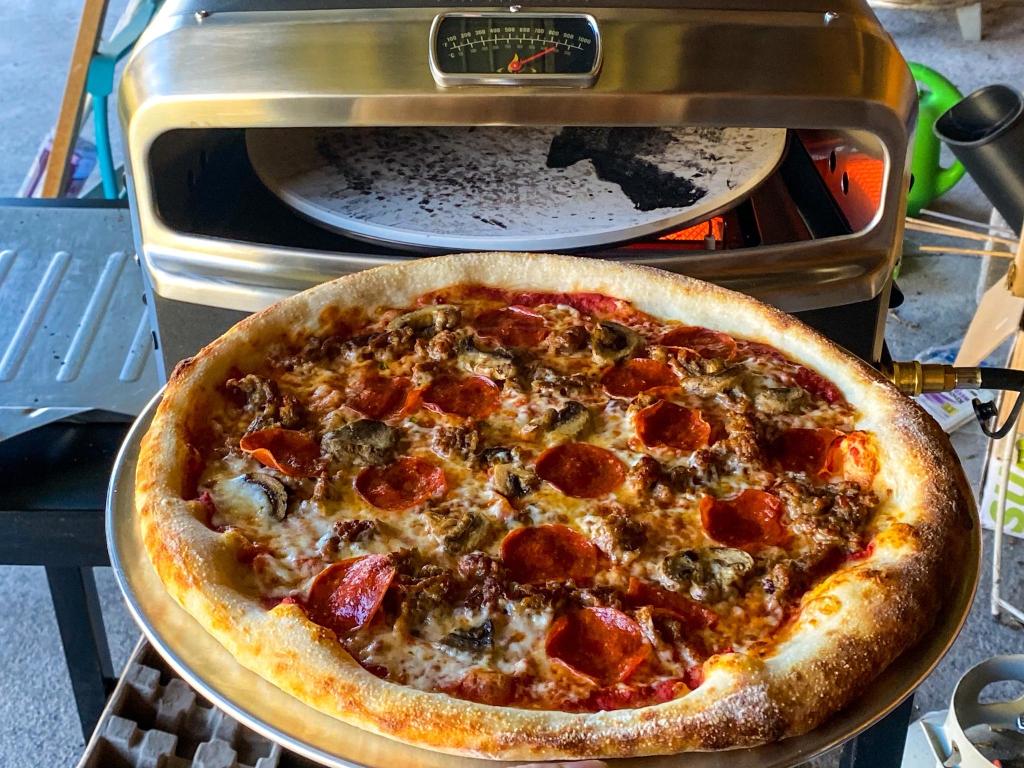 A New York style pizza in the Halo Versa 16 pizza oven